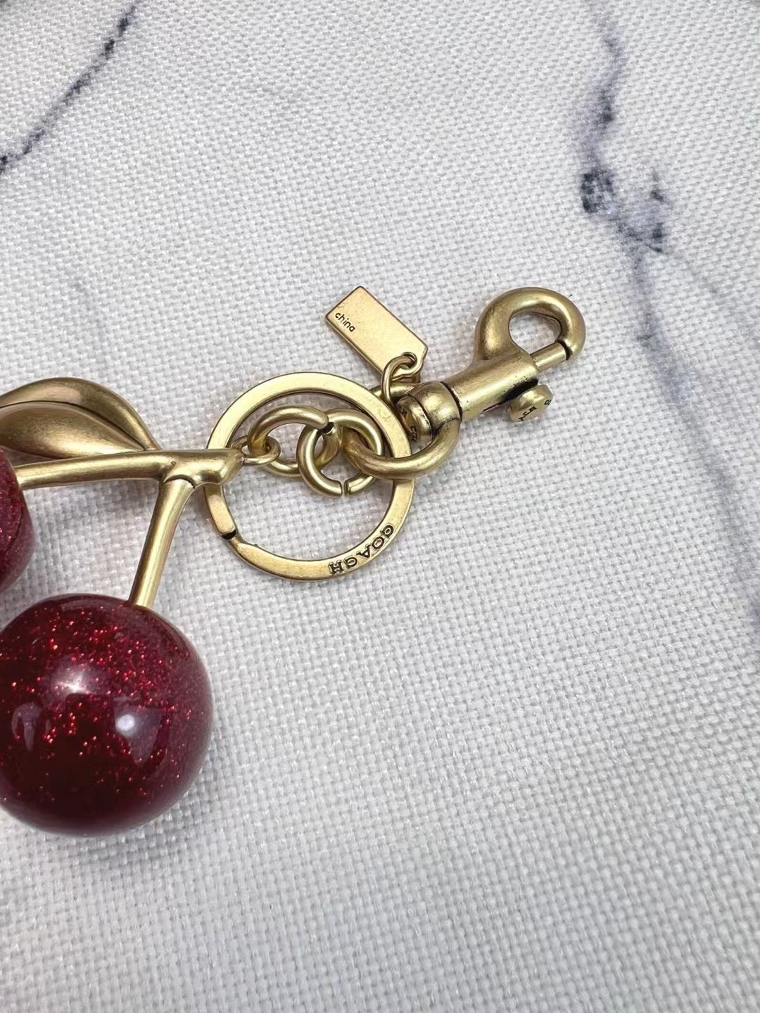 Coach cherry charm