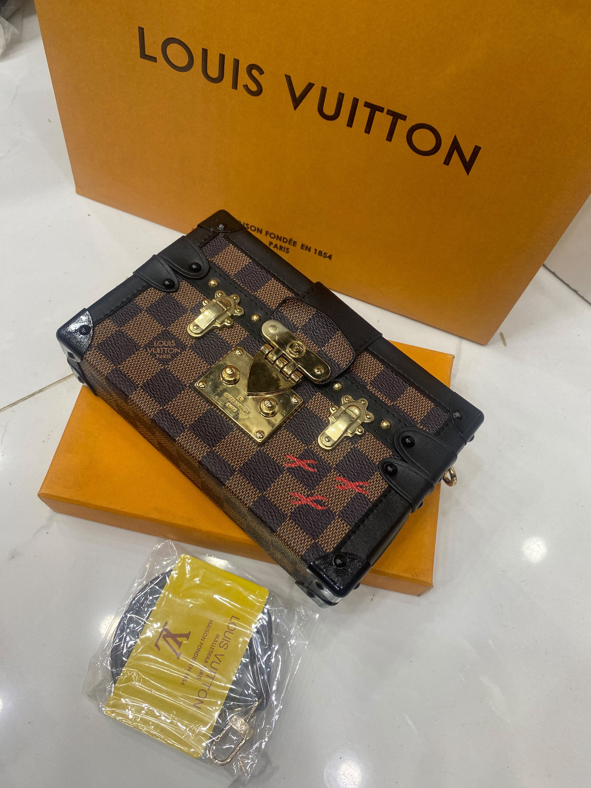 L V famous brand clutch