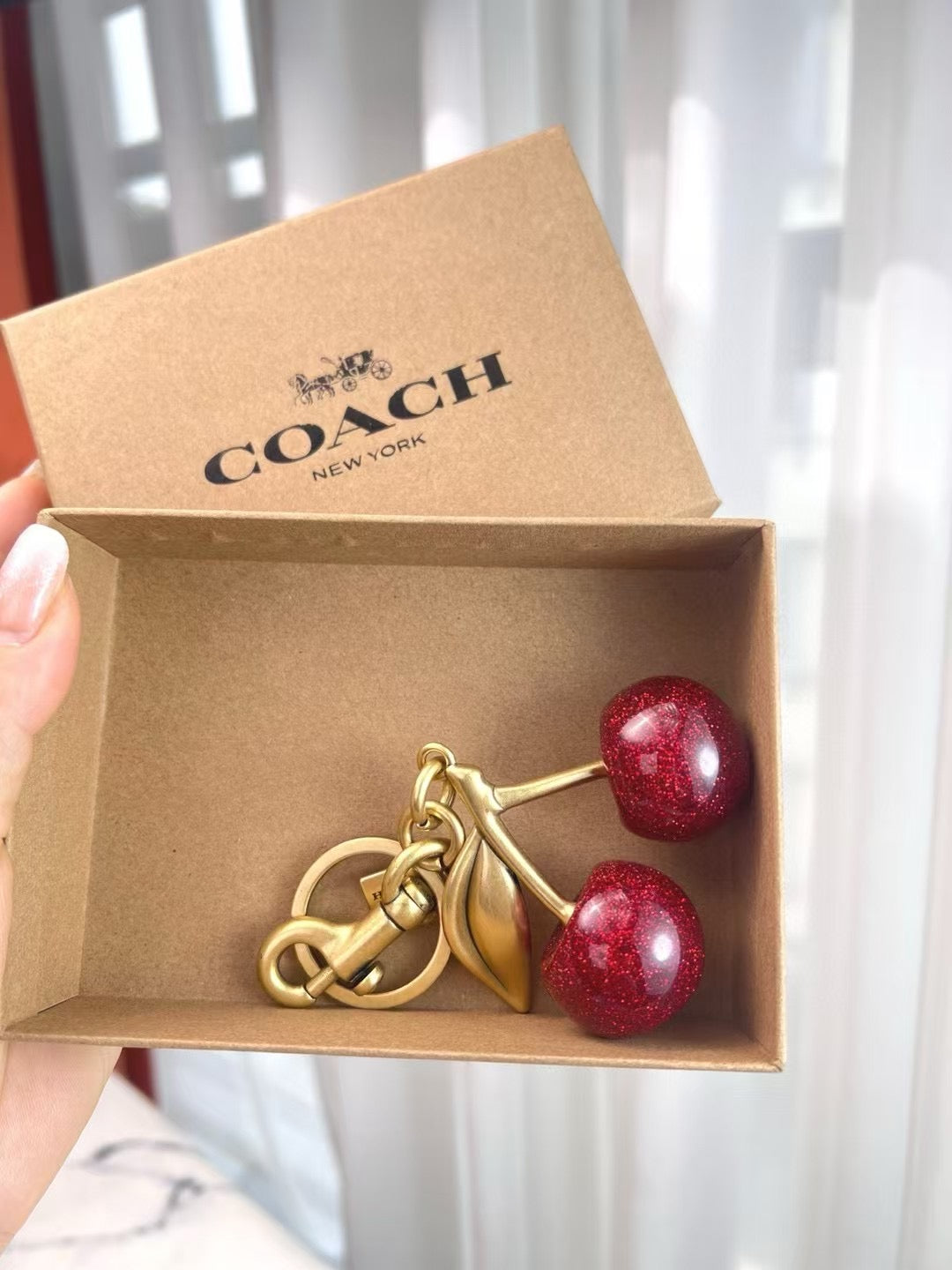 Coach cherry charm