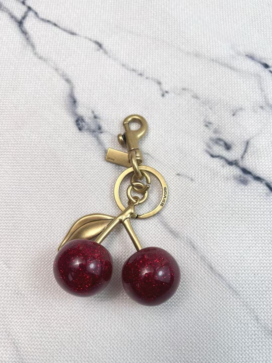 Coach cherry charm