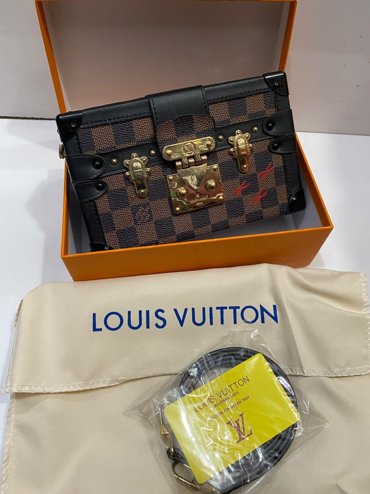 L V famous brand clutch