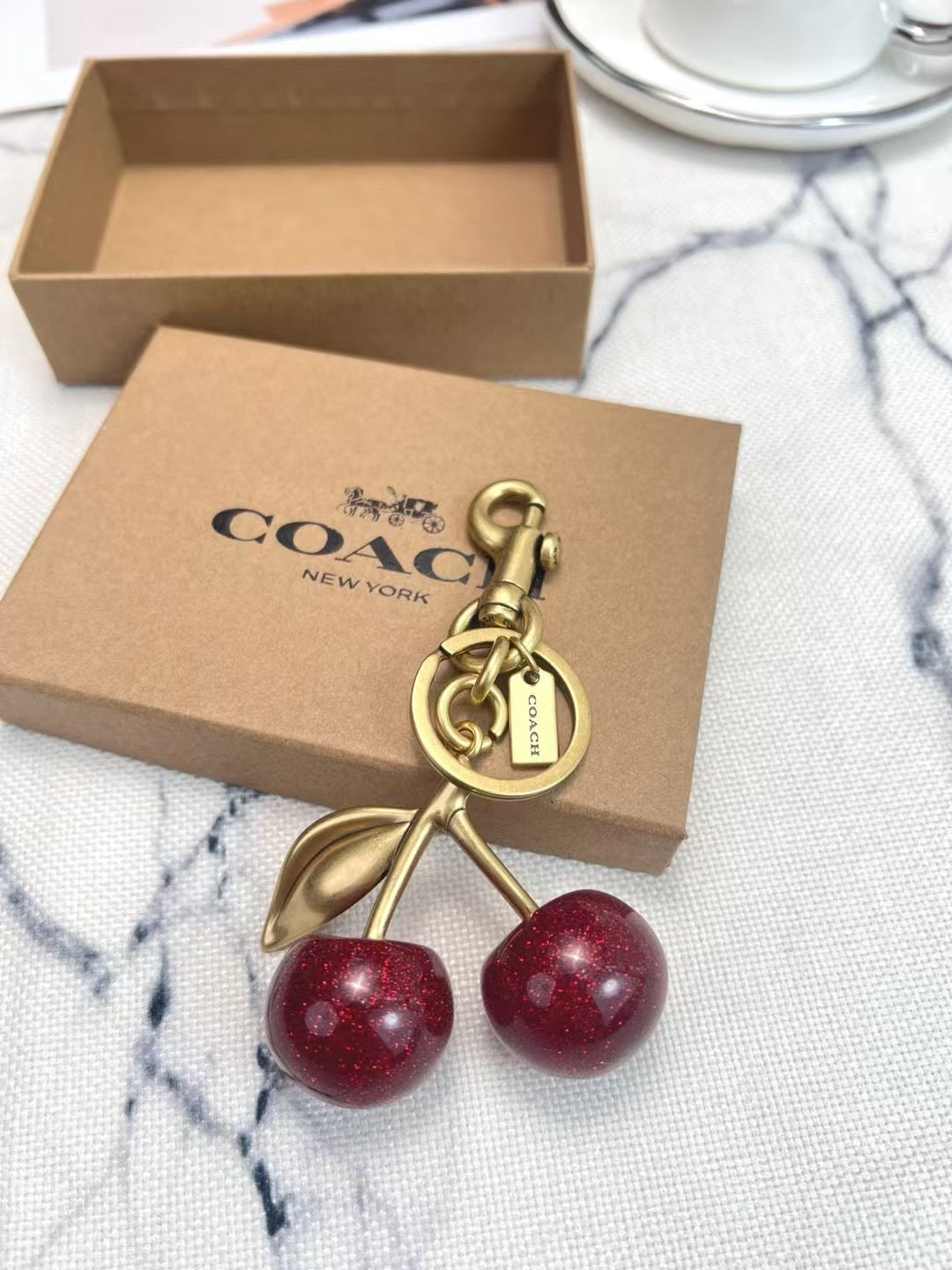 Coach cherry charm