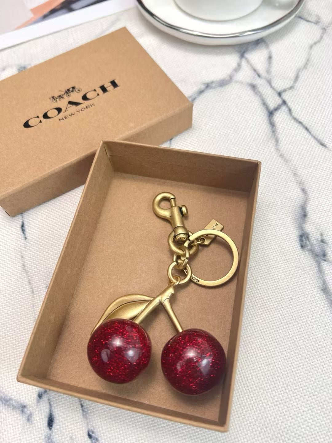 Coach cherry charm