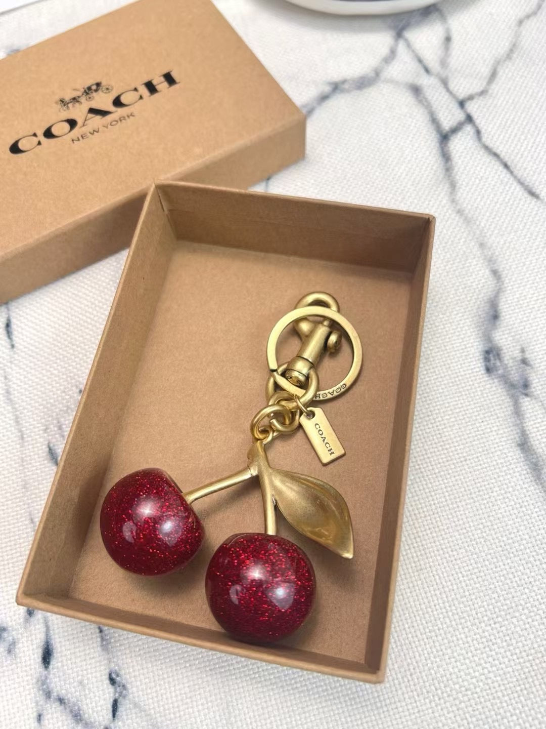 Coach cherry charm